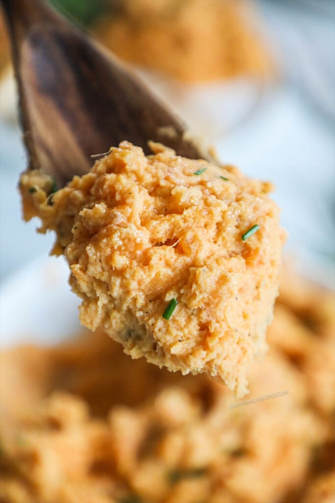 Spoonful of mashed sweet potatoes.