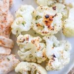 Golden brown parmesan roasted cauliflower on a plate.