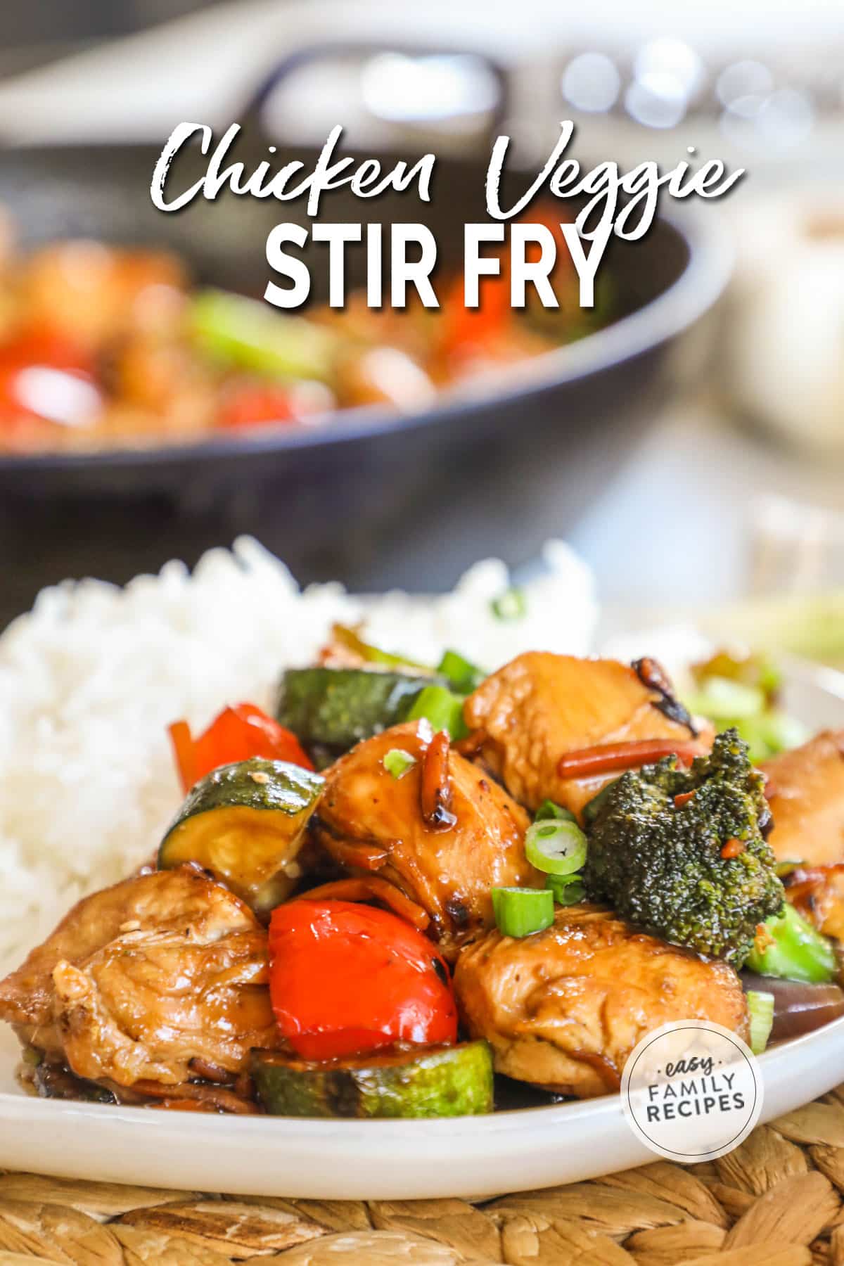 Plate of Chicken and Vegetable Stir Fry with white rice, with skillet in background