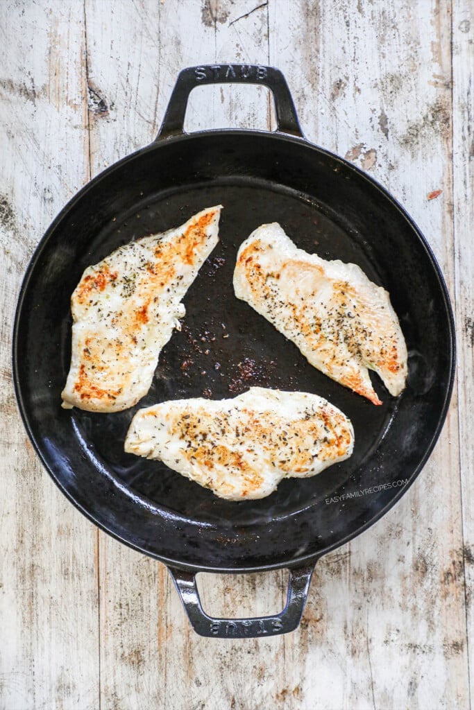 chicken searing in a skillet 