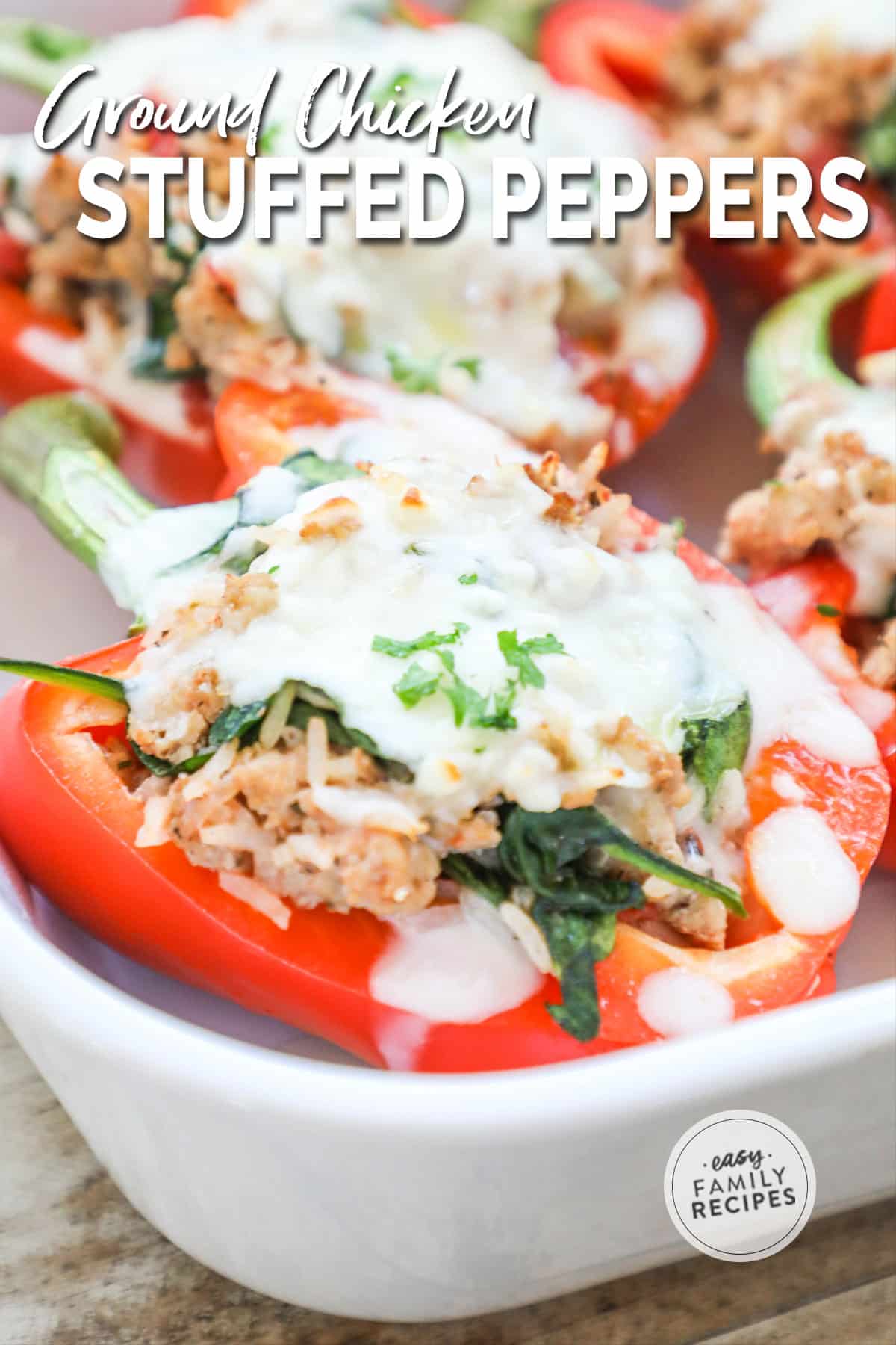 Closeup of ground chicken stuffed peppers in baking dish