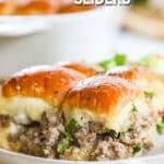 Philly Cheesesteak sliders with ground beef filling on Hawaiian rolls on a plate