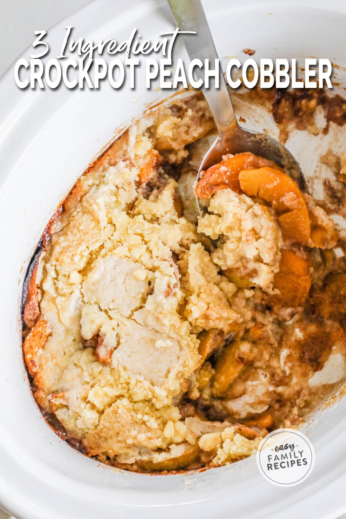 overhead of a crockpot filled with peach cobbler.