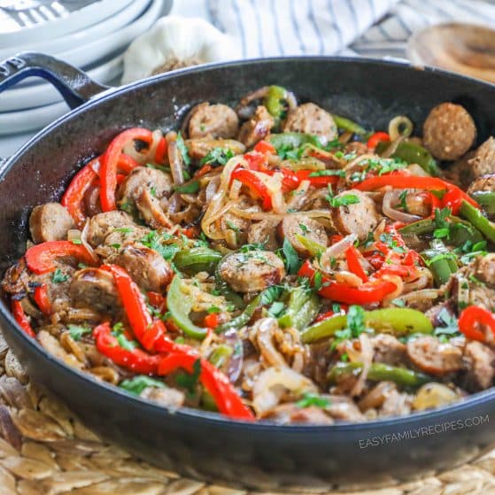 Skillet of sausage and peppers set on tabletop