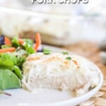 Creamy garlic pork chops served with green salad.