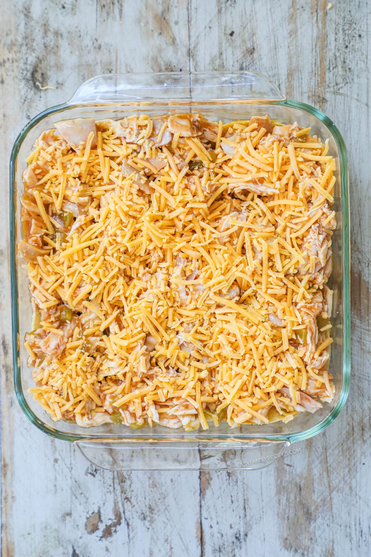 How to make chicken enchilada casserole step 3: Add a layer of cheese on top of the chicken.