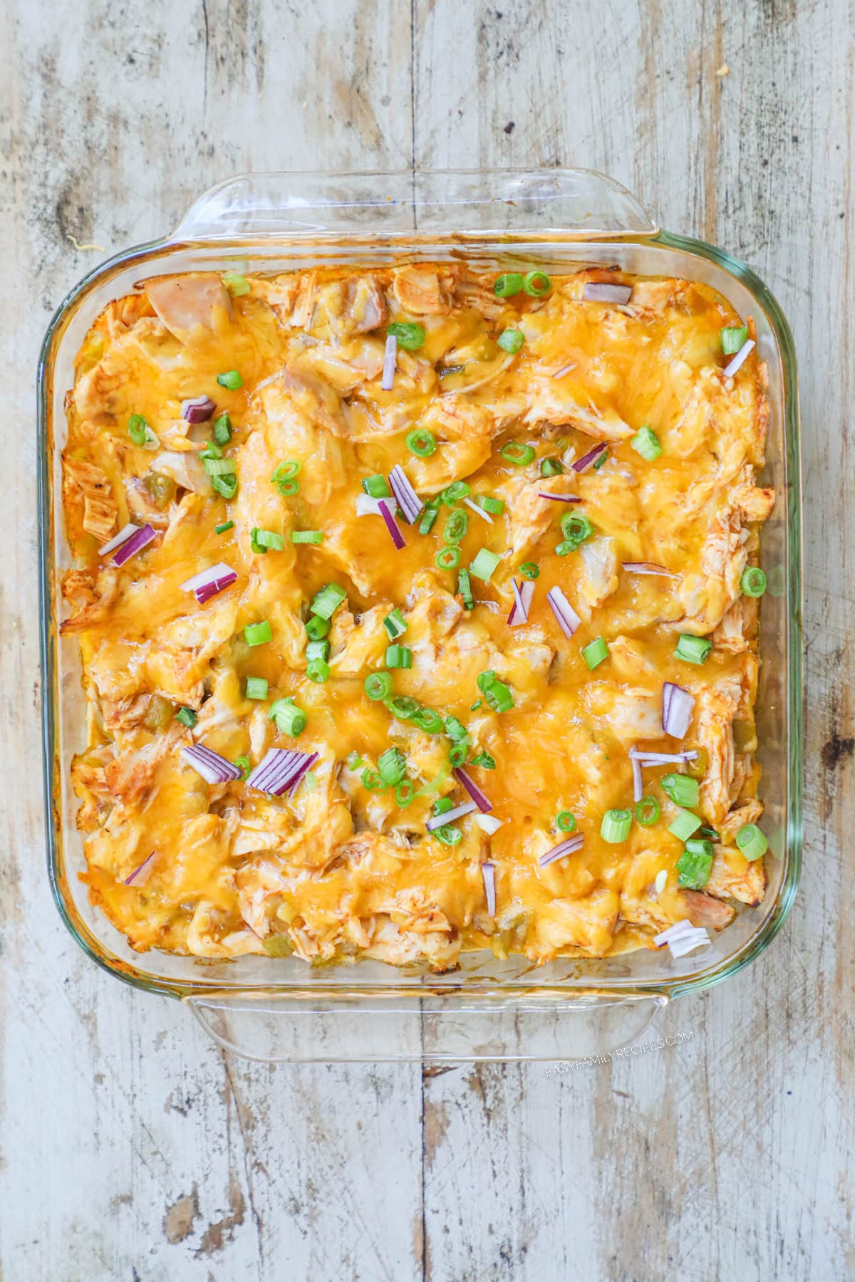 How to make chicken enchilada casserole step 4: Repeat layers until dish is full and top with cheese, then bake.