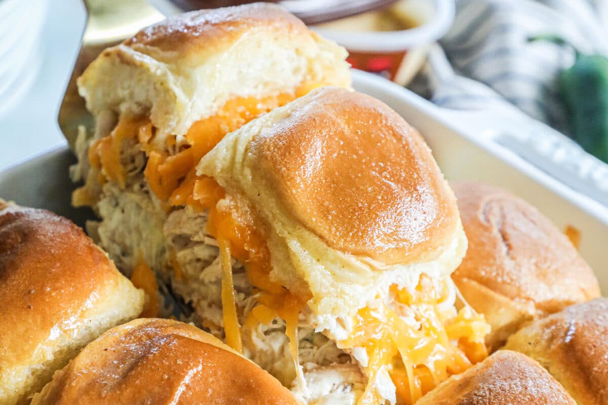 A close up image of shredded chicken jalapeno sliders on hawaiian rolls