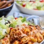 Easy Baked Tortellini Casserole on a plate with salad.