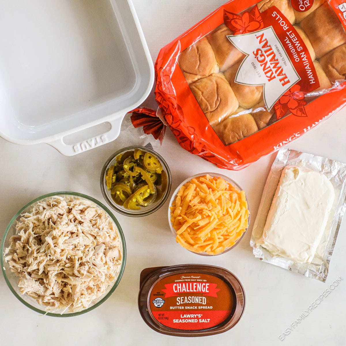 Ingredients to make Jalapeno Popper Sliders- cream cheese, shredded chicken, jalapeno peppers, cheddar cheese, lowerys seasoning salt, challenge butter