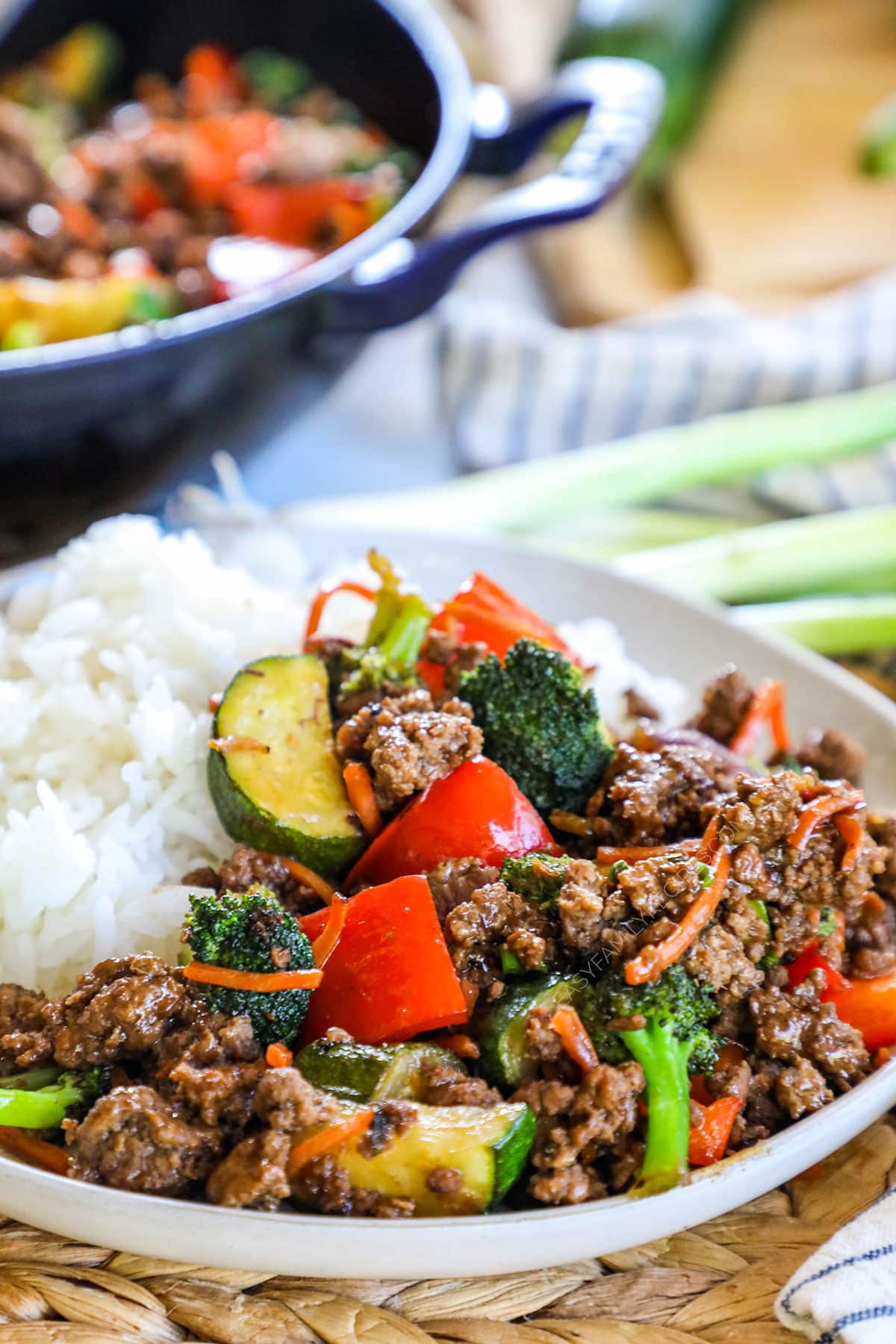 Ground beef stir fry on a plate with rice for an easy dinner.