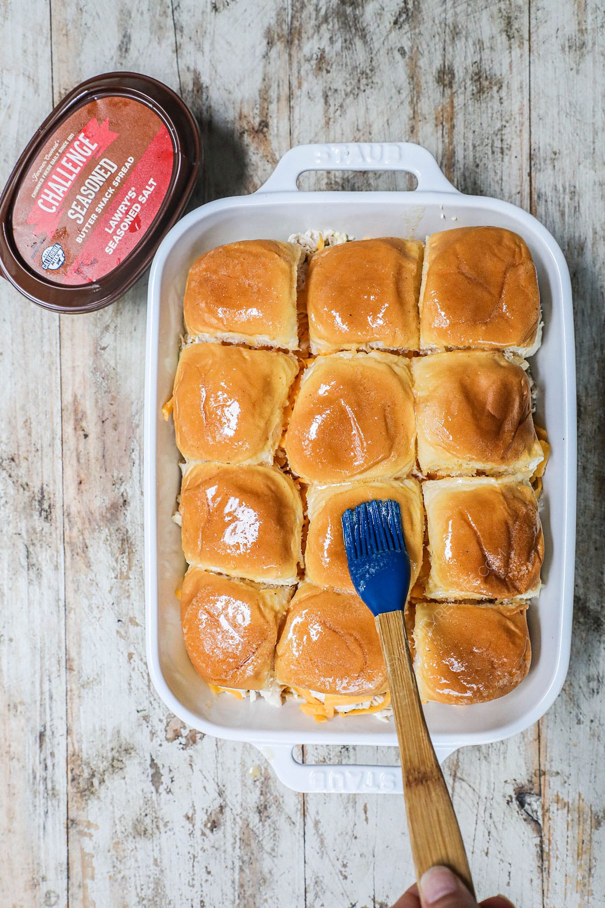 Spread melted butter and Lawry's seasoning salt on the top of the rolls and bake.