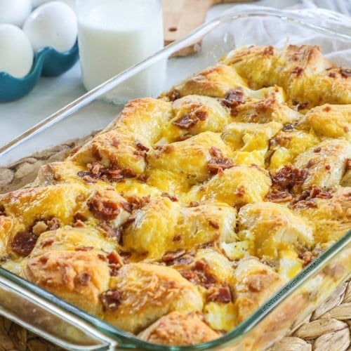 a baked biscuit egg breakfast casserole in a baking dish.