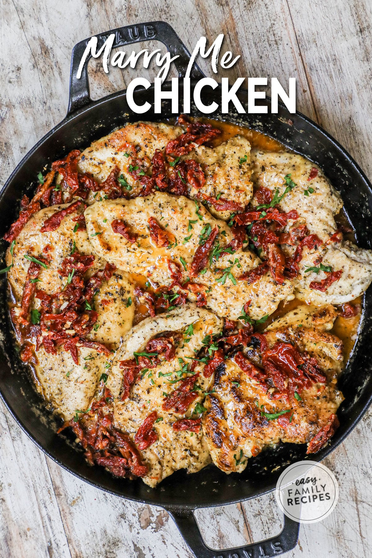 Picture has a pan full of marry chicken with a creamy sauce and sun-dried tomatoes and basil. 