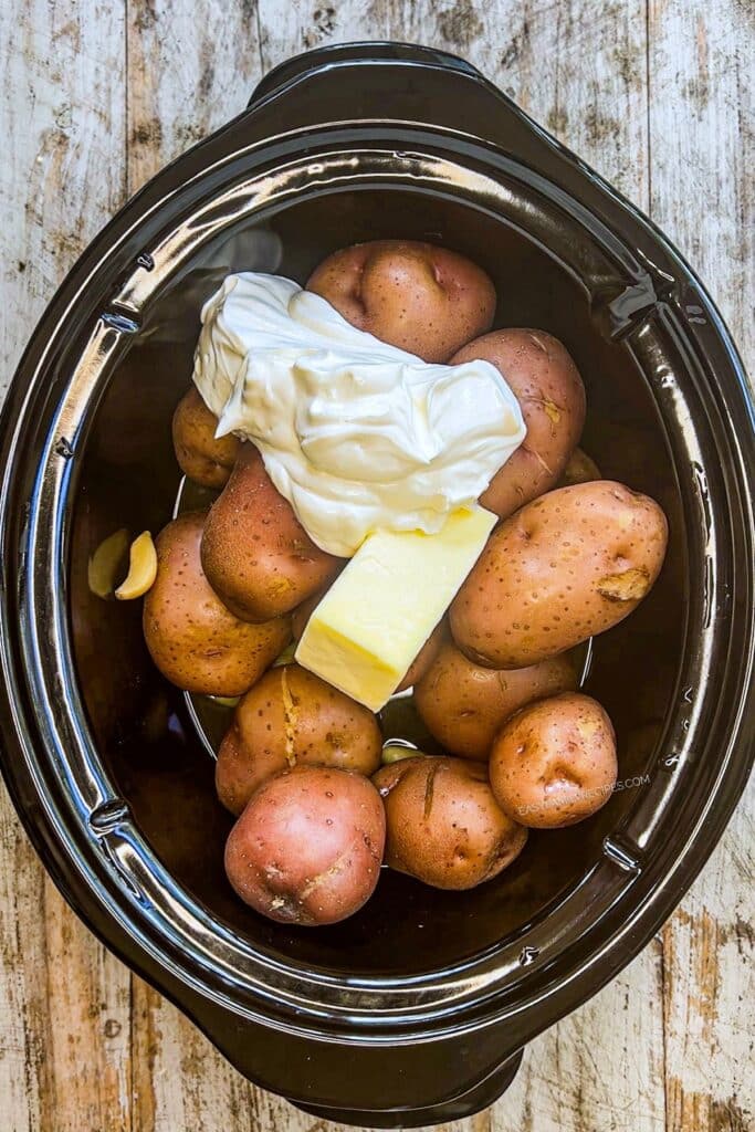 Step 2 - Add sour cream, butter, salt, pepper and oregano. Mash with a potato masher, mixing in the butter, sour cream, and seasonings as you go.