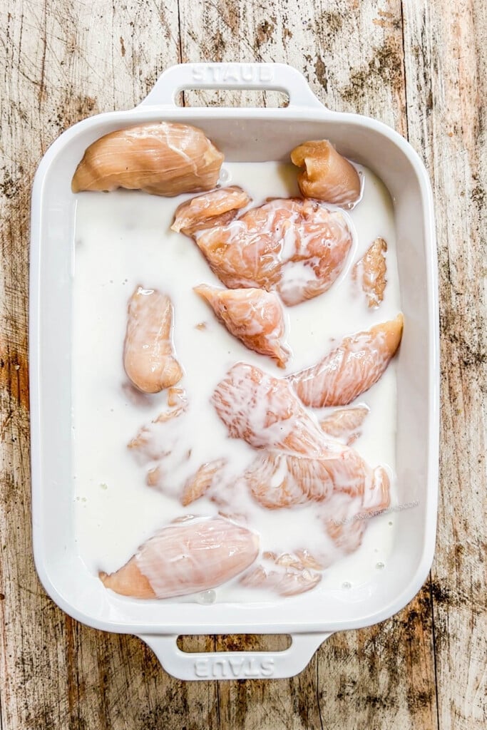 How to make Hot Honey Chicken Breast Step 1: Marinate chicken breast in buttermilk.