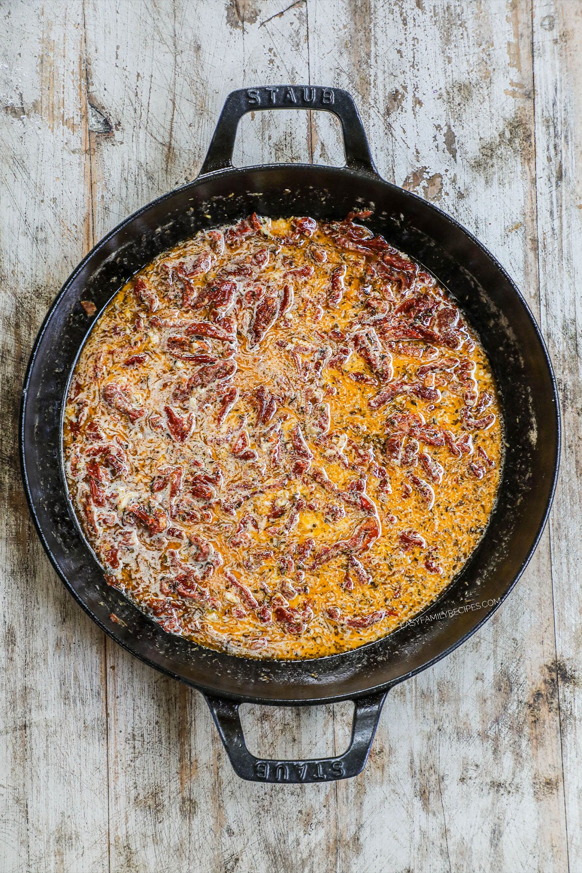 Step 3: Skillet of ingredients that make the creamy sauce. Sundried tomatoes, seasonings, broth and heavy cream