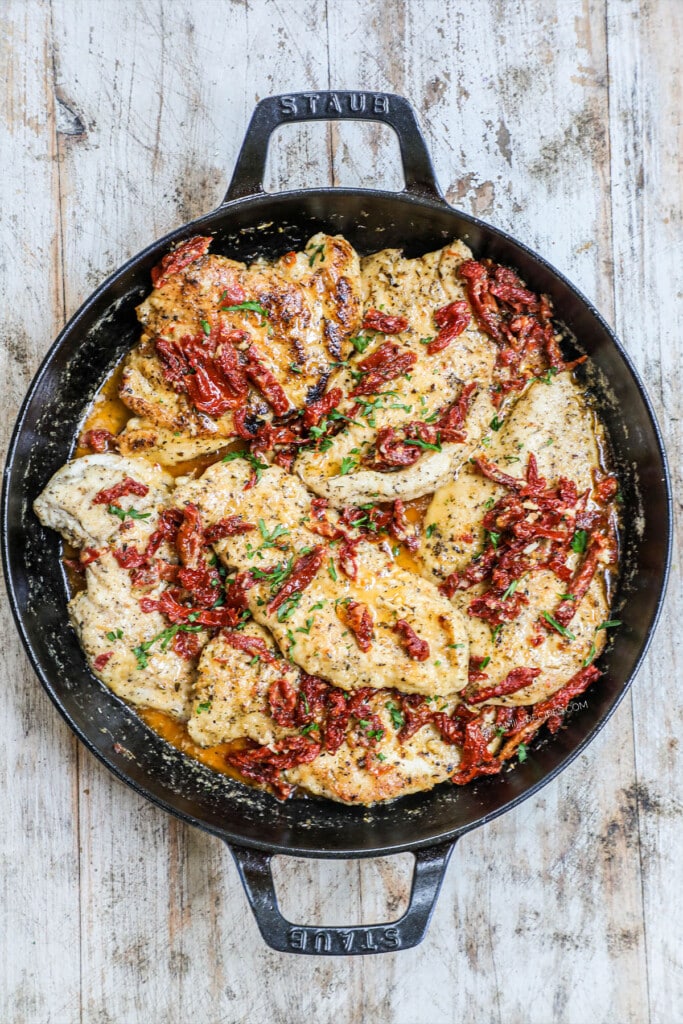 Step 4: Picture has a pan full of marry chicken with a creamy sauce and sun-dried tomatoes and basil.