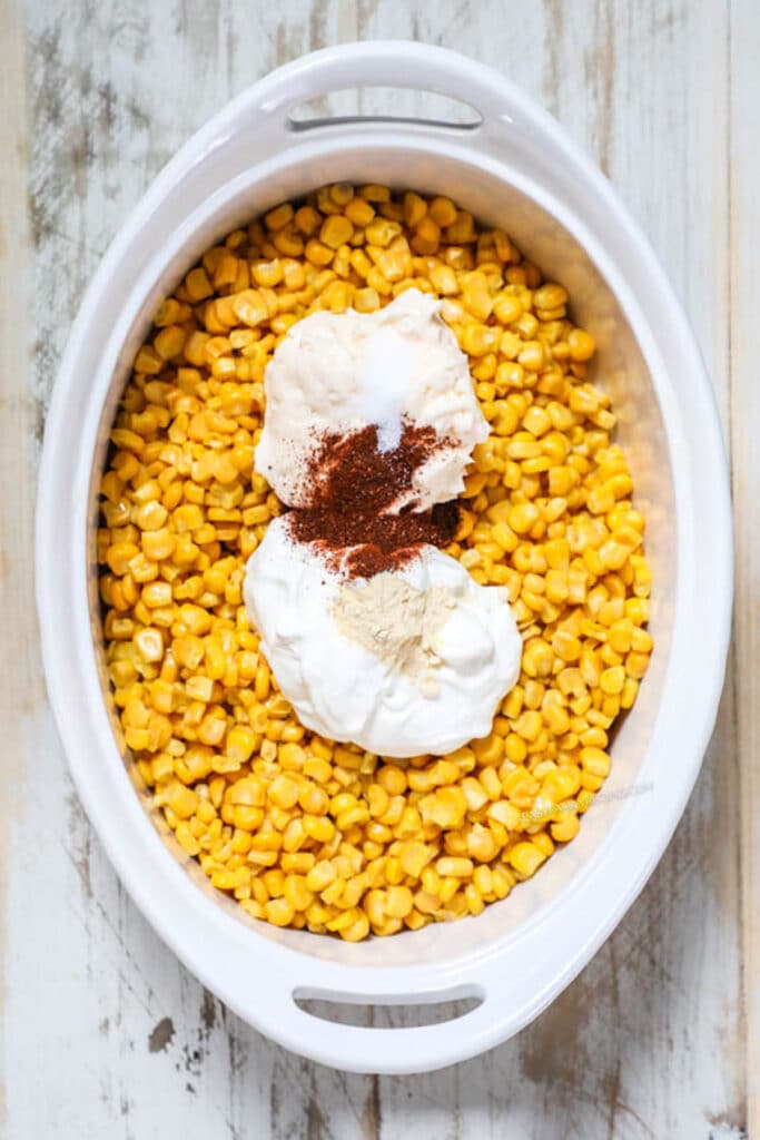 How to make Mexican Street Corn Casserole Step 2: Add mayonnaise, sour cream, and seasonings and mix.