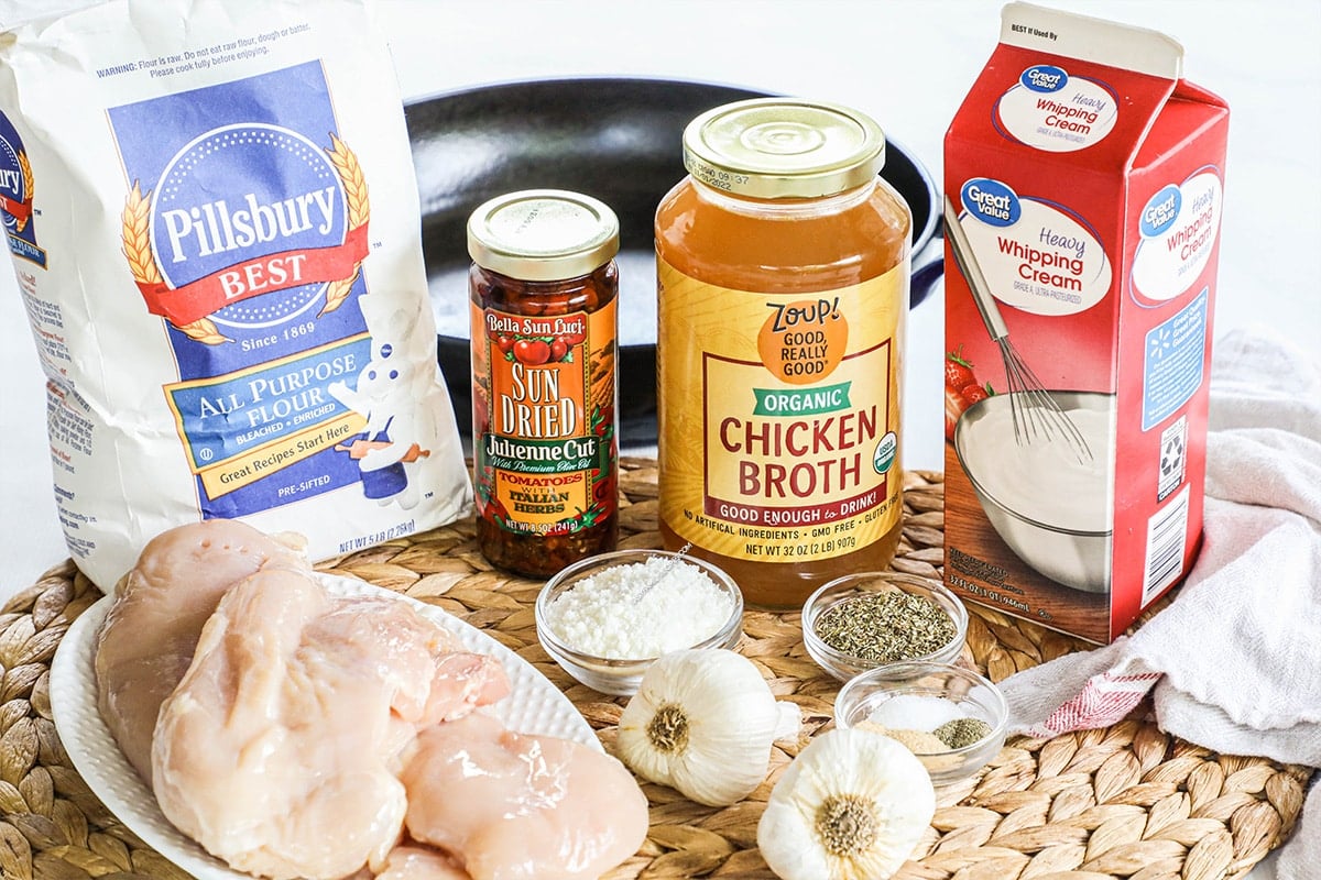 ingredients to make marry me chicken - chicken broth, seasonings, chicken breasts, sundried tomatoes and heavy cream