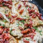 Picture has a pan full of marry chicken with a creamy sauce and sun-dried tomatoes and basil.