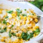 Scooping a serving of Mexican Street Corn Casserole out of a serving dish.