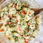 overhead images of a bowl of pesto tortellini salad.