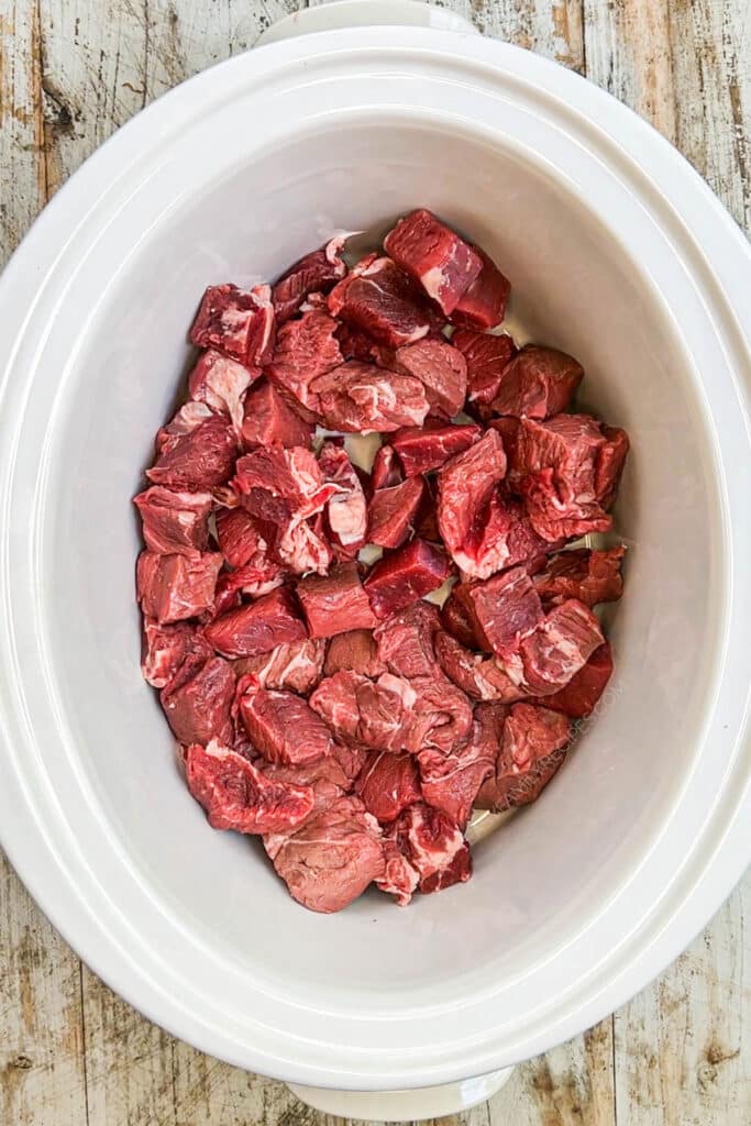 How to make crockpot steak bites step 1: Dice the steak and put it in the crockpot.