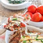 Chicken Bruschetta in a casserole dish being scooped out. Tender Chicken with Tomatoes, garlic and basil