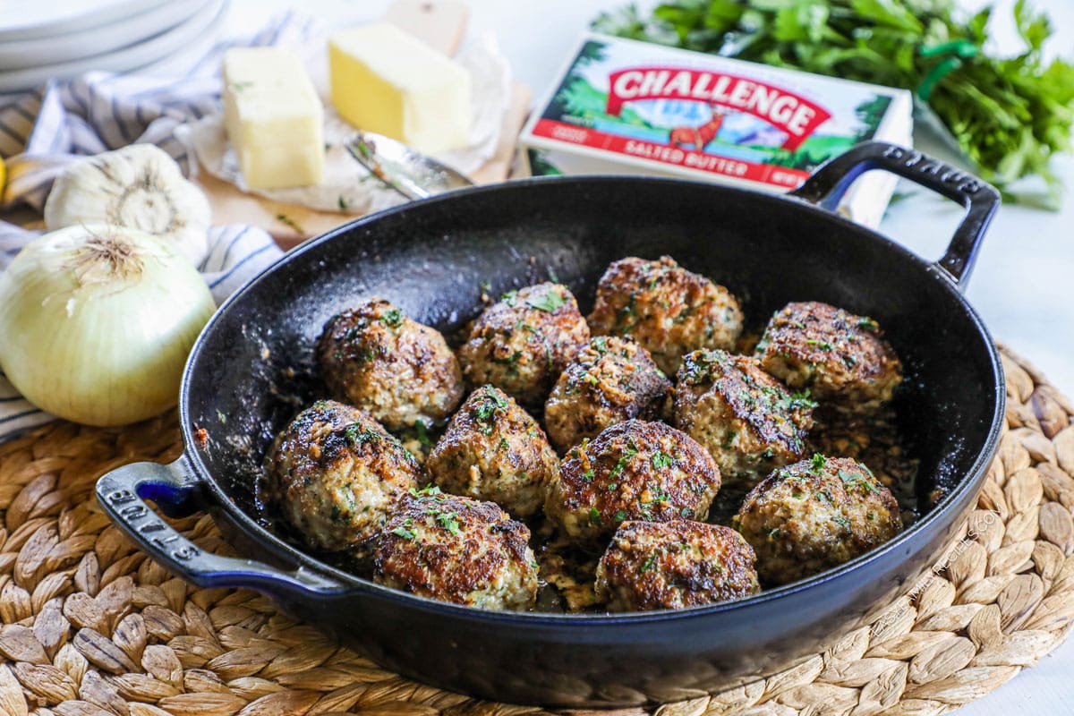 Garlic Butter Meatballs in a skillet with lemon butter garlic sauce