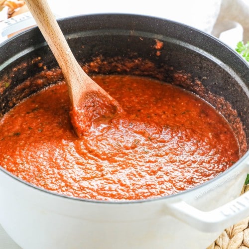 a large pot filled with hearty marinara sauce.