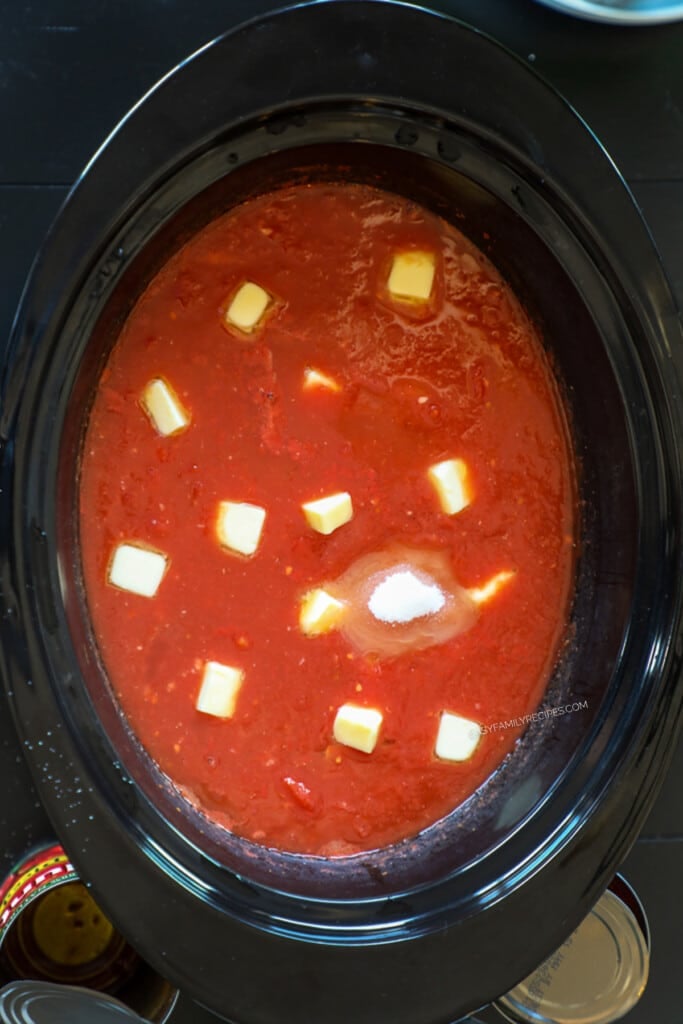 How to make tomato basil soup in a crockpot step 2: Stir in broth, sugar, and butter.