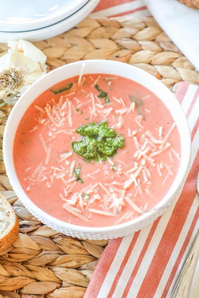 Overhead view of creamy tomato soup prepared in a crockpot.