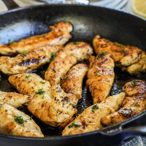 Lemon pepper chicken tenders in a pan