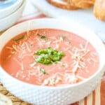 A bowl of Tomato Basil Soup with parmesan.