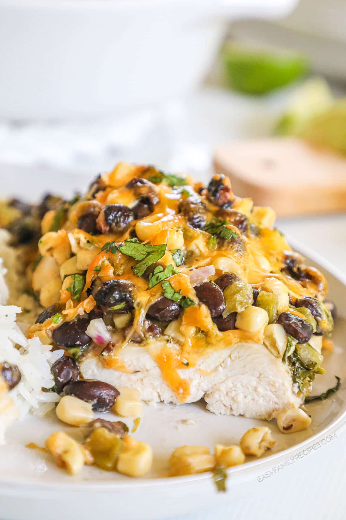Santa Fe chicken on plate with corn, black beans, cheese, and cilantro topping