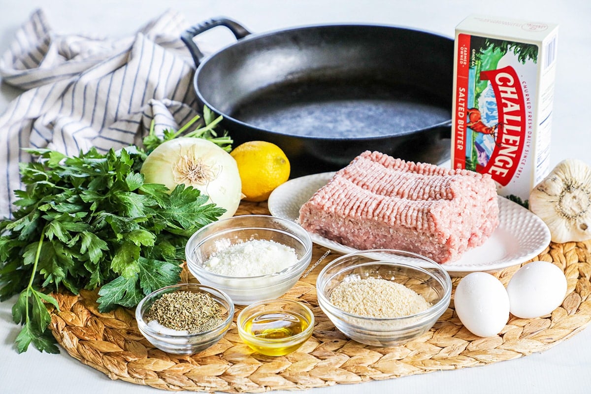 Ingredients to make Garlic Butter Meatballs- Ground Turkey, onion, butter, garlic, parsley, bread crumbs, parmesan, lemon, seasonings