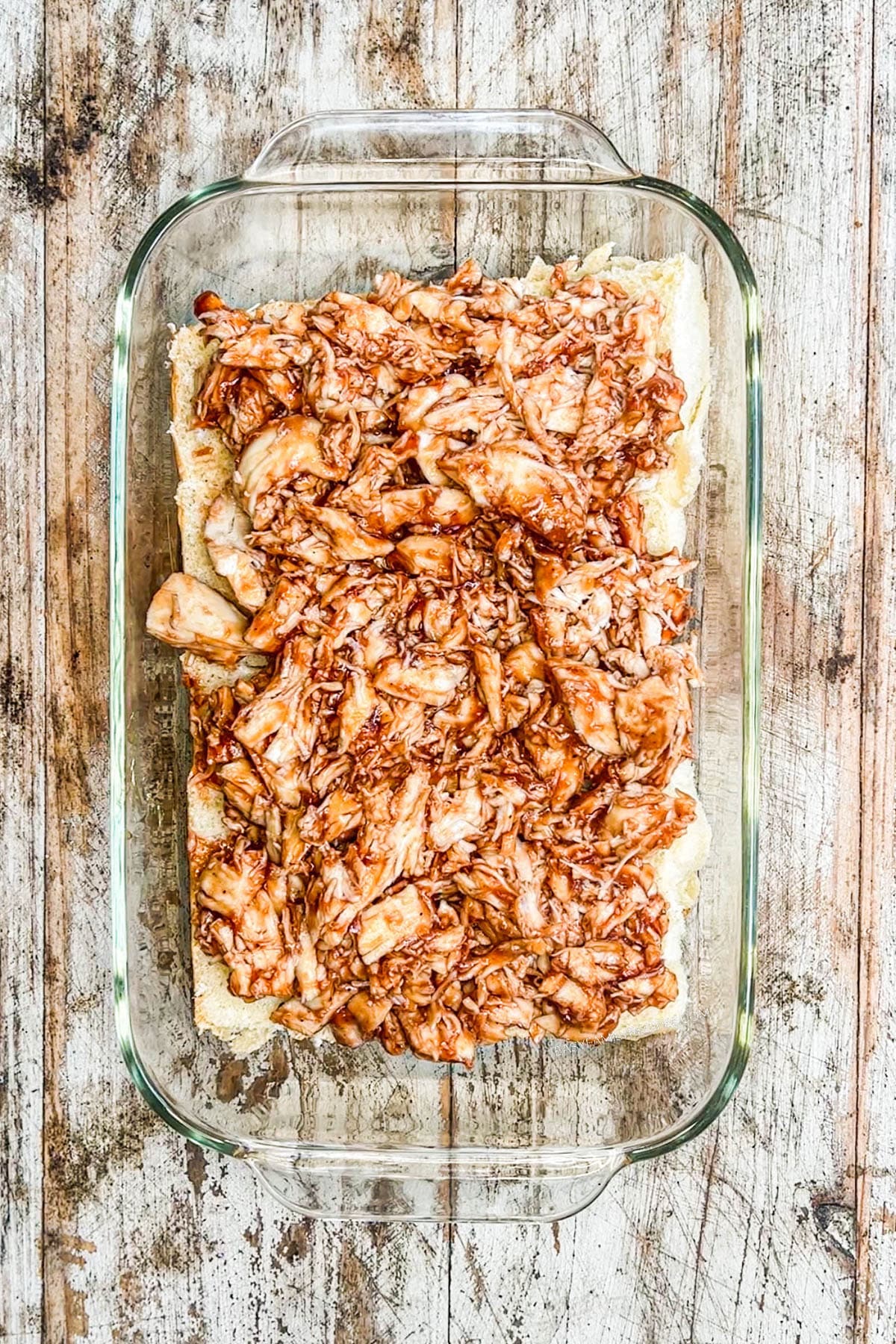 Step 1: Mix together the ingredients for the chicken, add on to the bottom half of the rolls that you have sliced. 