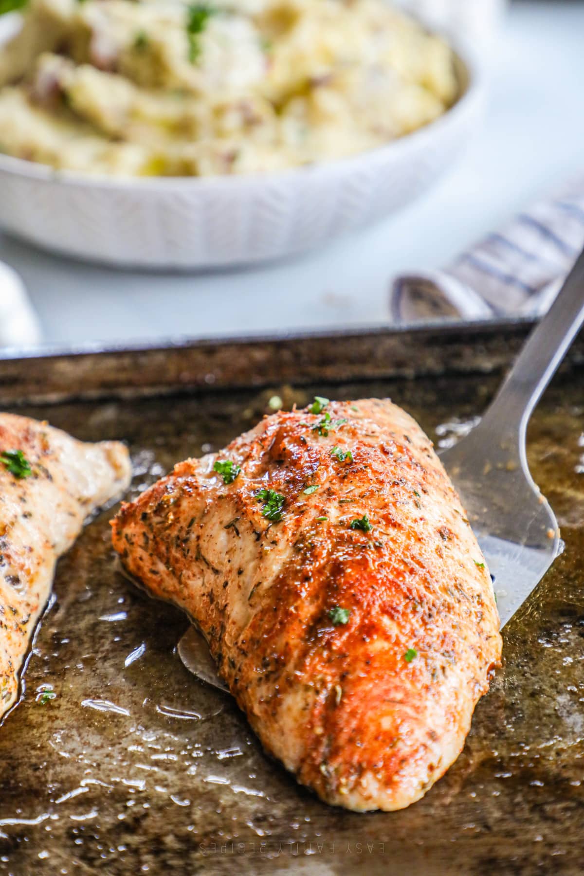 Baked Turkey Tenderloin fresh from the oven on a baking sheet.