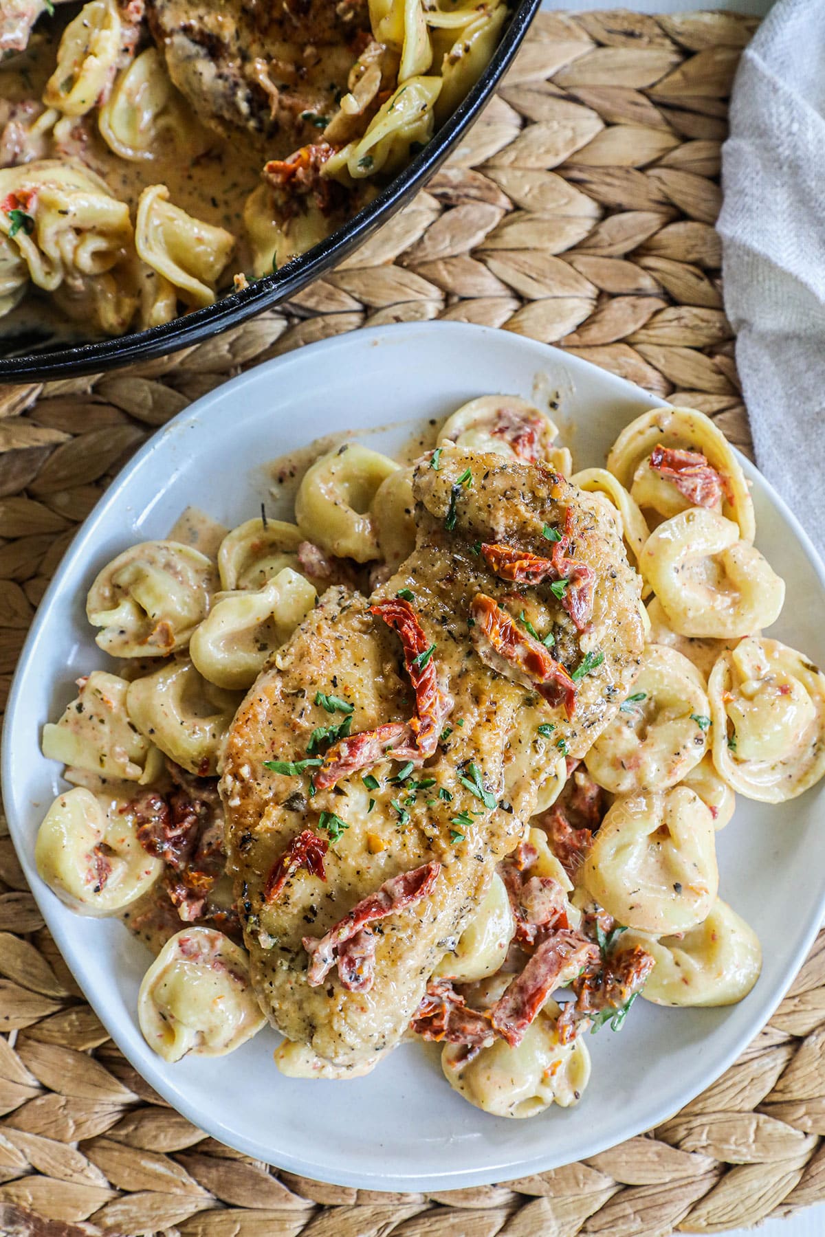 Marry me chicken and tortellini on a dinner plate ready to eat!