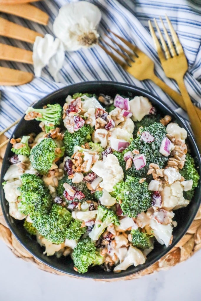 Broccoli Cauliflower salad in a serving dish garnished with sunflower seeds