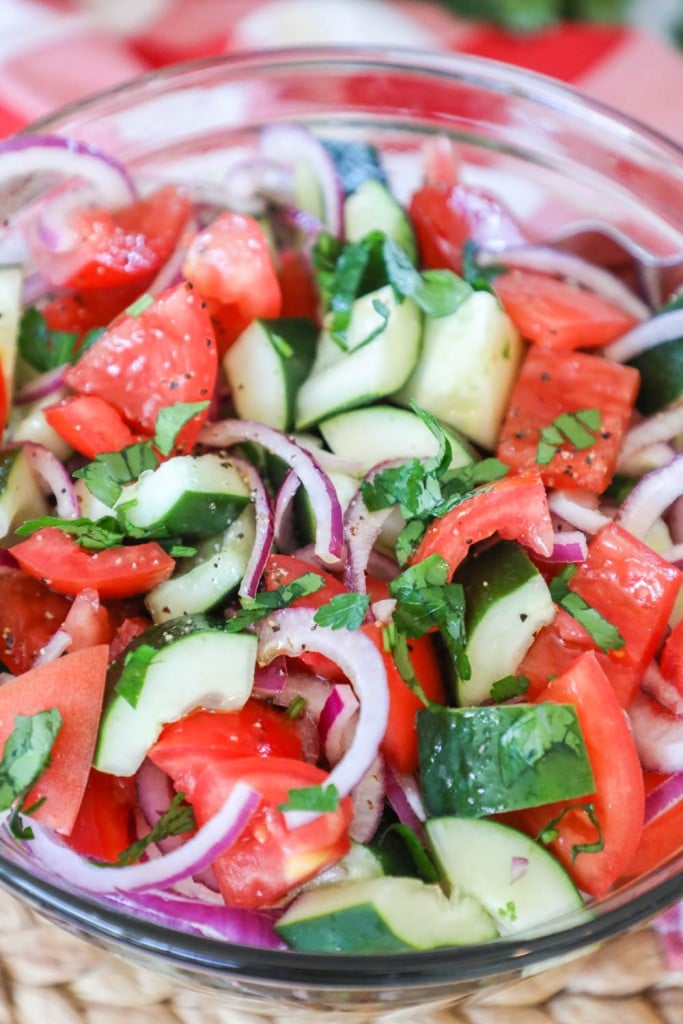 Classic cucumber tomato salad with red onions as a side dish