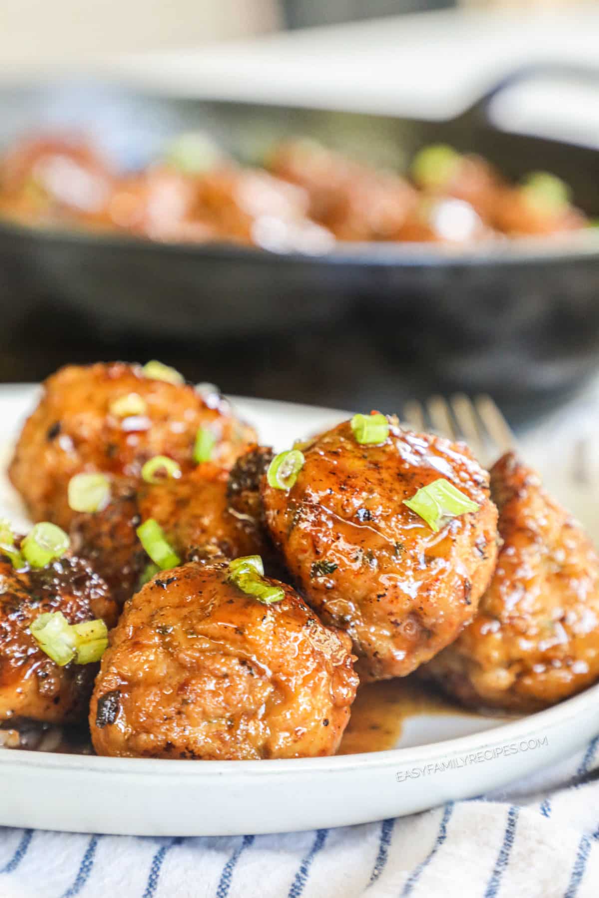 Firecracker chicken meatballs piled onto plate