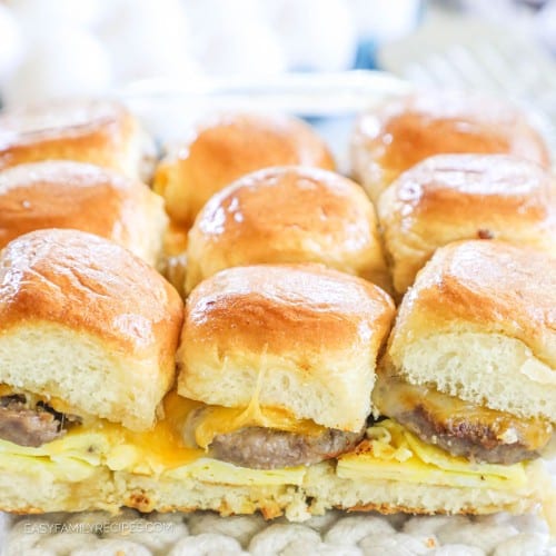 Closeup of Hawaiian roll breakfast sliders with sausage, eggs, and cheese