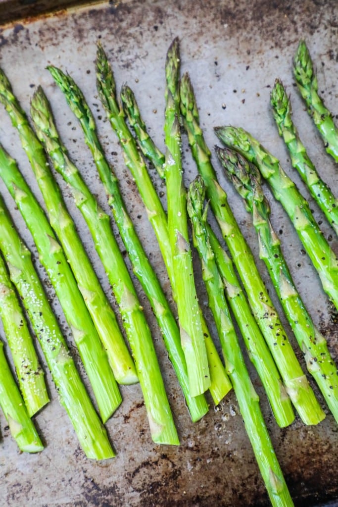 Oven Roasted Asparagus spears on a baking sheet