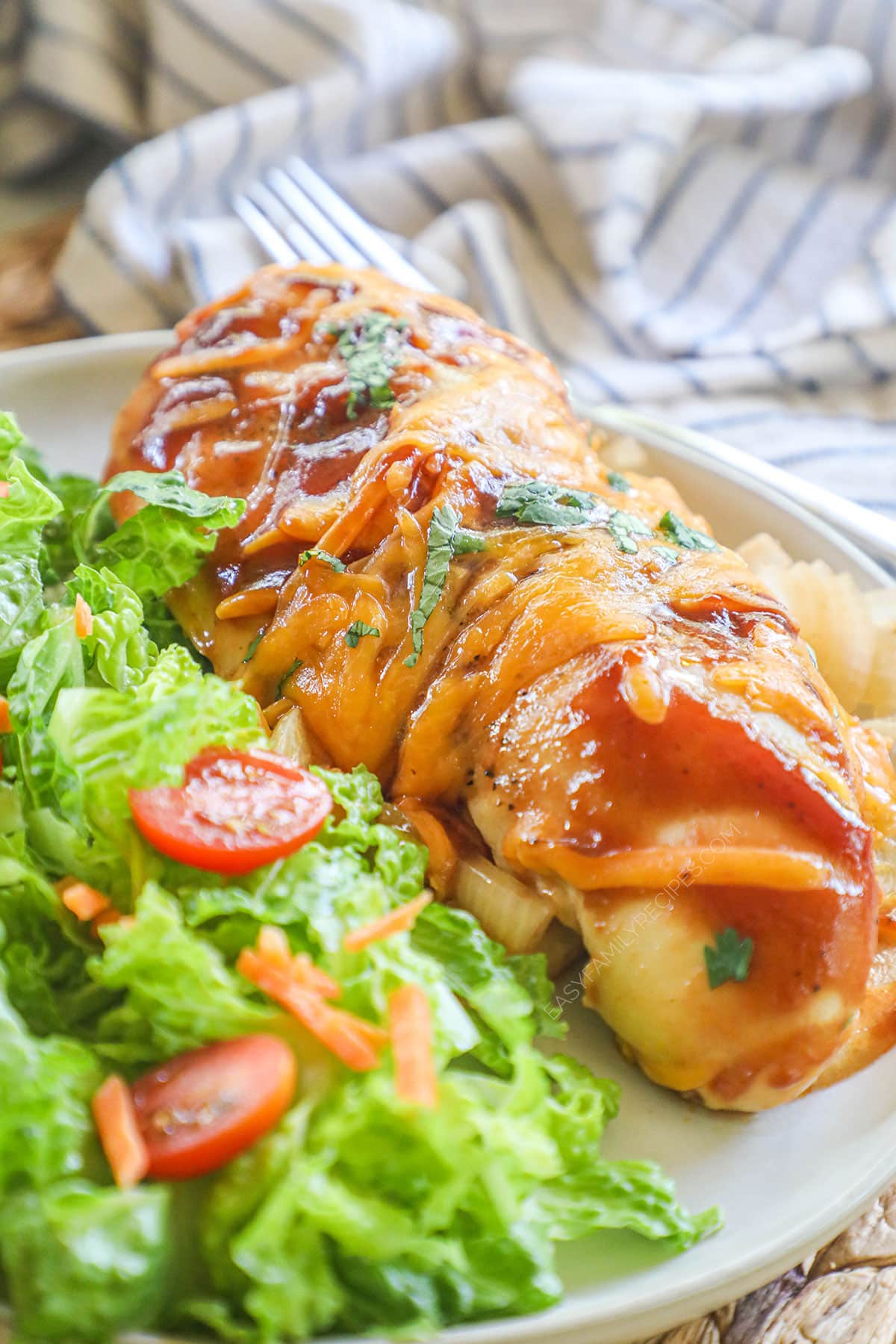 BBQ Chicken breast served with salad.