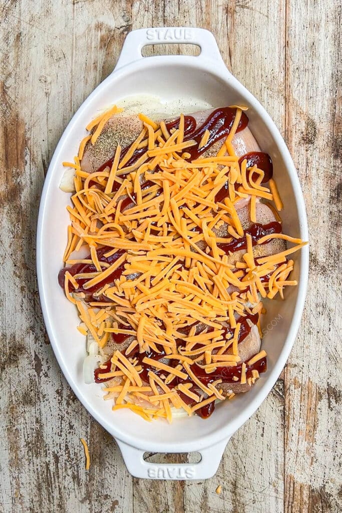 How to make BBQ Chicken in Oven Step 3: Top with shredded cheese.