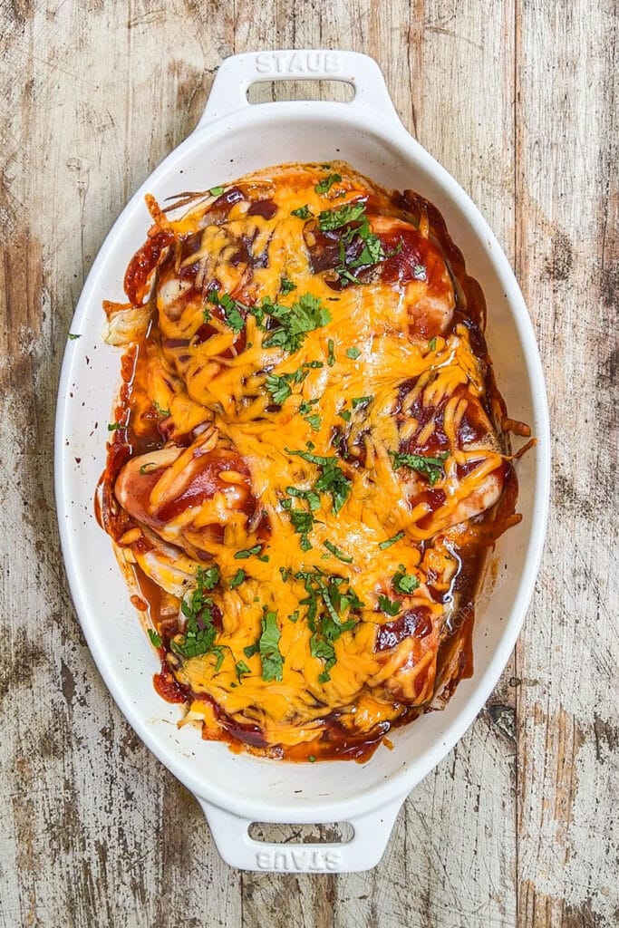 How to make BBQ Chicken in Oven Step 4: Bake until chicken is cooked through and cheese is melted.