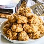 A plate of cheddar bay sausage balls stacked on top of each other.