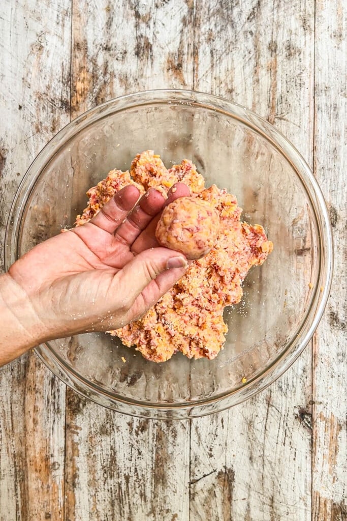 How to make cheddar bay sausage balls step 4: roll into balls.